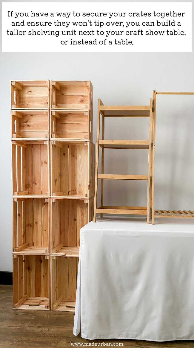 Crates stacked on the floor in a craft show display